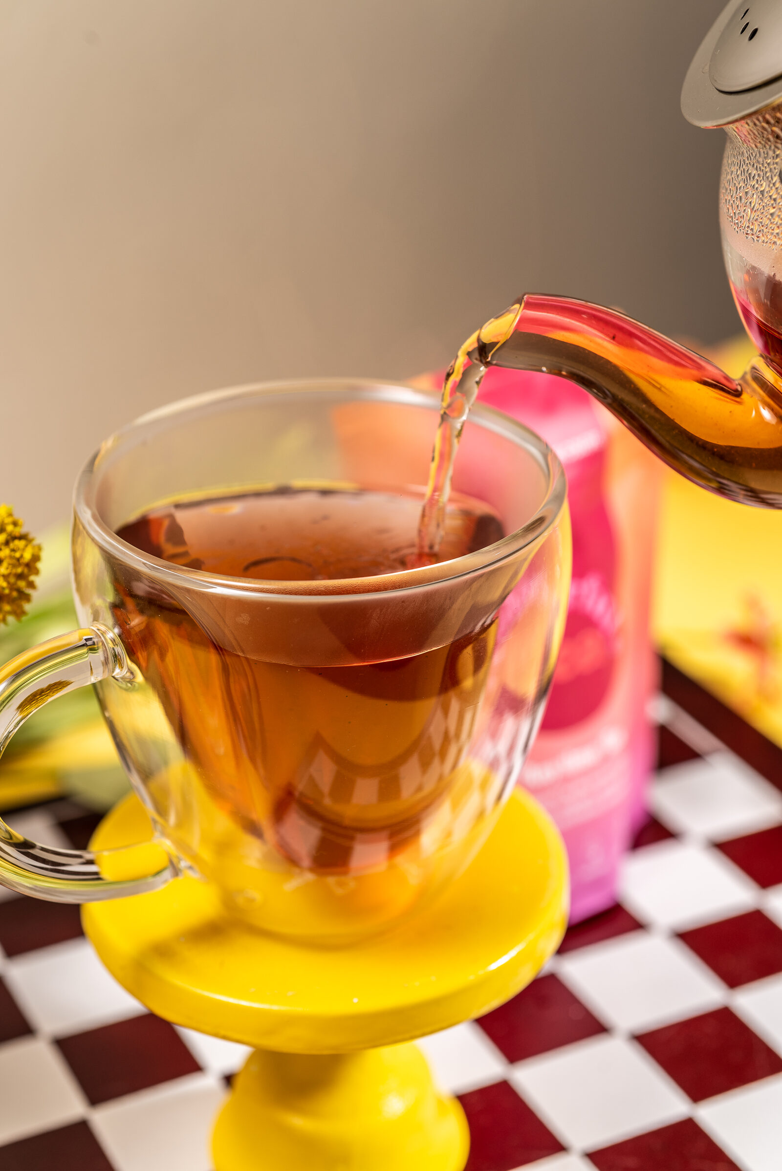 A vibrant cup of Colorful Tea being poured